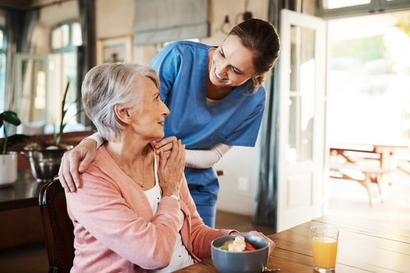 elderly woman with nurse at home